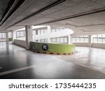 ramp of a parking structure. There is a yellow, black symbol. This image is the parking lot of the department store.