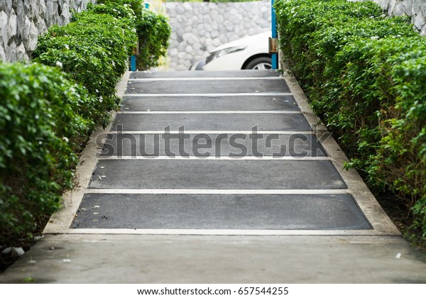 ramp way for\
support wheelchair disabled people.Using wheelchair ramp\
(Barrier-free access).Selective\
focus.