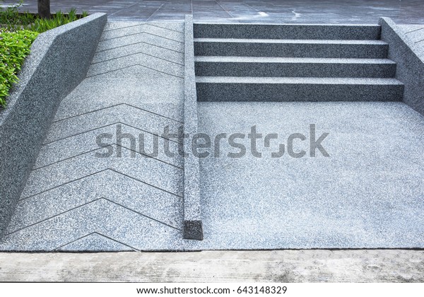 ramp for the wheelchair and stairs for normal\
people adjoining\
