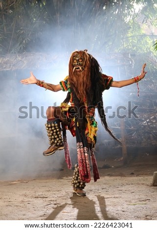 Rampak Buto Dance. This dance describes the nature of an angry buto (giant). Small bells are attached to his feet so that they make a jingling sound when dancing.
