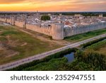 The ramparts, towers and tiled roofs of the historical walled town Aigues-Mortes in Camargue region, southern France