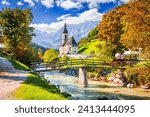 Ramsau, Berchtesgaden - Germany. Autumn scenery in Bavaria with Parish Church of St. Sebastian and River Ramsauer Ache.