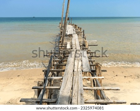 Ramshackle wooden jetty leads to the sea at the fishing village Teluk Bahang in the north of the island of Penang in Malaysia