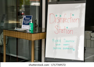 Ramstein, Germany - April 29, 2020: Disinfection Station At Doctor's Office Entrance In Ramstein, Germany With Hand Sanitizer And A Face Mask.