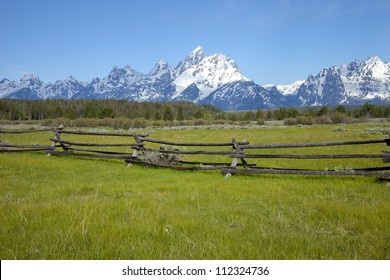 Ranch Fence Below Grand Tetons Mountain Range