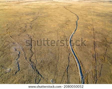 ranch road and cattle trails - aerial view of Pawnee National Grassland in northern Colorado