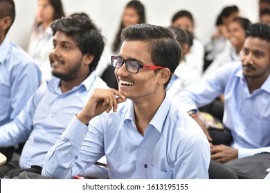 Ranchi, Jharkhand- december 13 2019 : young male student from audience smiling. Happy Indian college boy, listening the speech. Group of People Audience Seminar Enjoyment Concept. Engineering College
