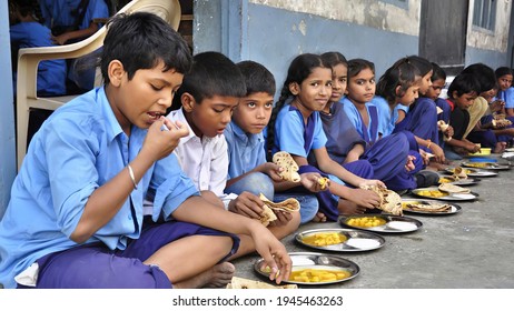 Ranchi, Jharkhand, India - march 22 2021 : Indian school children getting their mid-day meal in their school. 