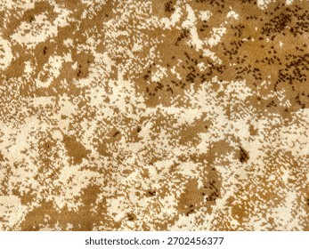 Random design with abstract pattern hand tufted carpet texture, in yellow, gold, and brown color. Random wavy washed pattern carpet rug seamless background texture