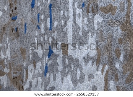 Random design with abstract pattern hand tufted carpet texture, in shades of blue, dark blue, and tosca color. Random blue pattern carpet rug seamless background texture