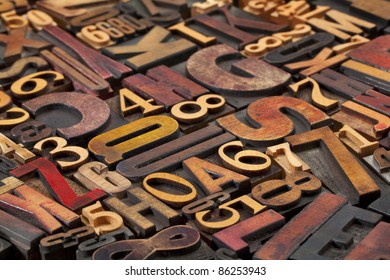 Random Letters And Numbers In Antique Wood Letterpress Printing Blocks Of Various Size And Style