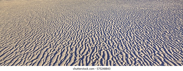 Random Light-shade Pattern On White Silica Sandy Whitehaven Beach Of Whitsundays Island Formed In Wind Work Traces Of Soft Soil.