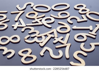 random numbers mathematics arithmetic complex calculations random number theory wooden numbers on a gray black background