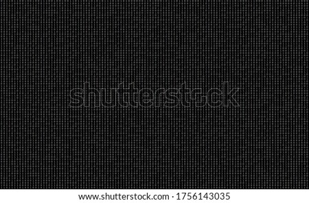 Random pattern of black and white binary code with ones and zeros on a terminal screen background