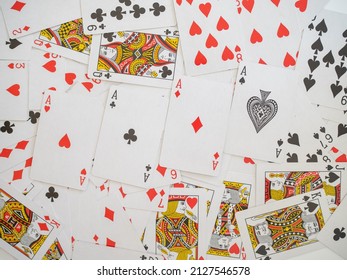 random  playing cards background with four aces on top