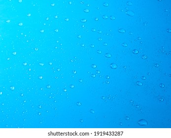 Random water drops on the blue PVC surface