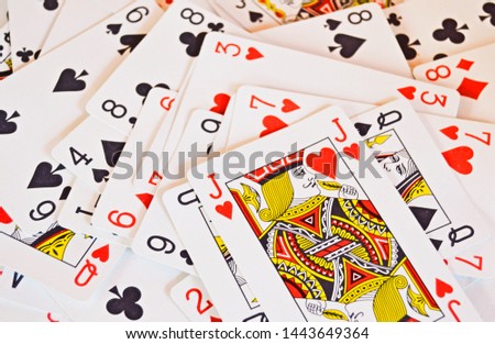 Randomly distributed playing cards with no background