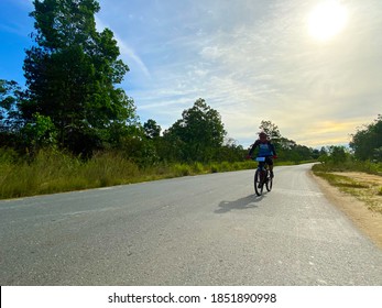 RANGAU, INDONESIA - OCTOBER 17, 2020: Virtual Bike Ride For Carity Organized By PT PLN (Persero) Joined By The Man Who Through Among Sunny And Cloudy.