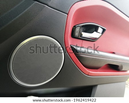 range rover evoque. car door. the interior of the car. car door speaker. red leather in the interior.