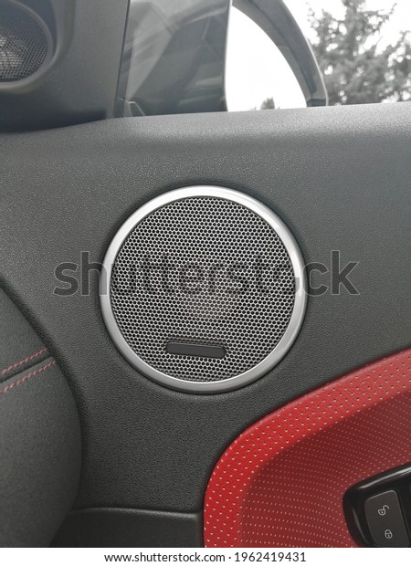 range rover evoque. car\
door. the interior of the car. car door speaker. red leather in the\
interior.