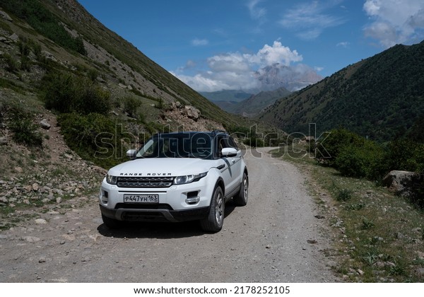 Range Rover\
Evoque car on the background of the mountains of the North Caucasus\
in Russia. Sunny day on June 6,\
2022