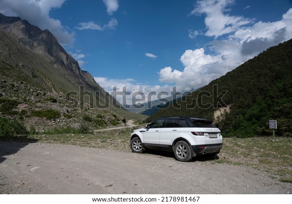 Range Rover\
Evoque car on the background of the mountains of the North Caucasus\
in Russia. Sunny day on June 6,\
2022