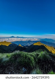“Mountain Ranges Touching the Blue Horizon”
Dramatic landscape of ridges fading into the clouds under a vibrant blue sky.