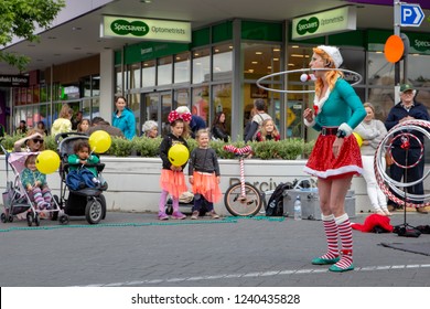 Rangiora, New Zealand - November 23 2018: An Elf Street Performer Entertains Families At The Christmas Community Street Market Evening