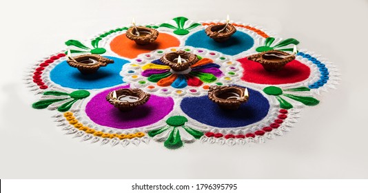 Rangoli Design is an art form made during using powder colours during Diwali, Onam, Pongal, Hindu festivals in India - Powered by Shutterstock