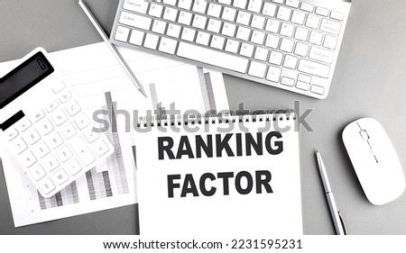 RANKING FACTOR text written on a notebook on grey background with chart and keyboard, business concept Stock photo © 