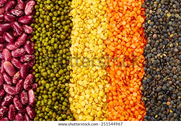 ranks of various legumes (red lentils, black\
lentils, yellow lentils, red beans, green mung beans) isolated on\
white background