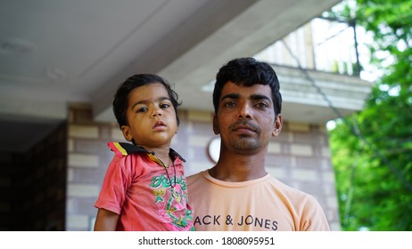 Ranoli, Jaipur, India-21 March 2020;
Young Indian And Cheerful Kid Eagerly Facing At The Camera. Curly Hair Children Wearing Red T Shirt.