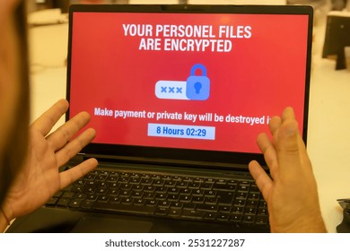 Ransomware Alert Displayed on Laptop Screen - Ransomware Attack on Personal Files - Cybersecurity Threat: Ransomware Detected - Powered by Shutterstock