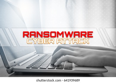 Ransomware Cyber Attack With Hand On Keyboard