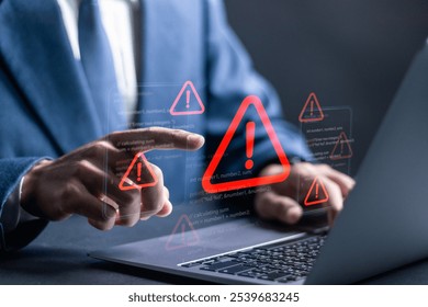 Ransomware malware attack and data breach. Businessman using laptop with spam virus on warning caution for notification on internet security protect.