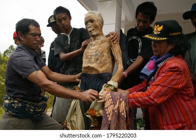 RANTEPAO, INDONESIA, 22 August 2012: A number of residents in North Toraja, South Sulawesi Province, Indonesia, are performing the Manene ritual, changing their ancestral clothes.