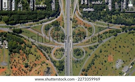 Raod, highway, flyover road junction - spaghetti and roundabout looking down aerial view from above, bird’s eye view expressway and intersection landscape, Brasília, Brazil
