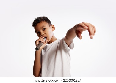 Rap Music. Portrait Of Little Boy Singing With Microphone Isolated On White Backgroud. Human Emotions, Facial Expression, Art, Music Concept.