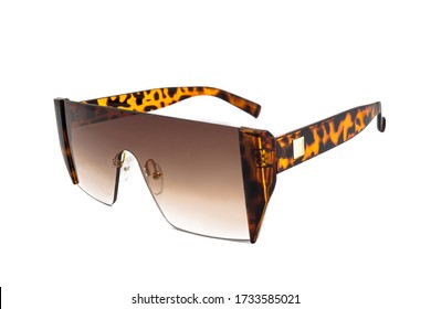 Rap star hiphop style rimless sunglasses and brown color gradient mono lens  flat top   leopard texture earpiece  isolated white background  side view 