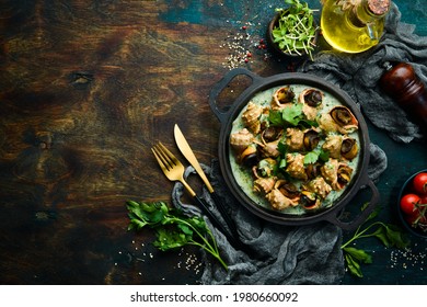 Rapana is cooked in shells with creamy spinach sauce. Luxury restaurant food. Seafood. Rustic style. Flat Lay. - Shutterstock ID 1980660092