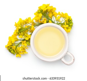 Rapeseed Oil With Rape Flowers Isolated On White Background. Top View