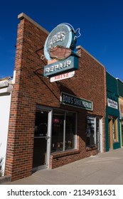 Rapid City, South Dakota - May 26, 2020: A Vintage Neon Sign For Bob's Shoe Repair, In The Downtown Area. Vertical Shot.