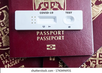 Rapid Serology COVID-19 Test Cassette On Red Biometric Passport,travel In The Time Of Coronavirus Concept,antibody Testing Upon Arrival Or Departure To If Person Was Infected,proof Of Convalescence 