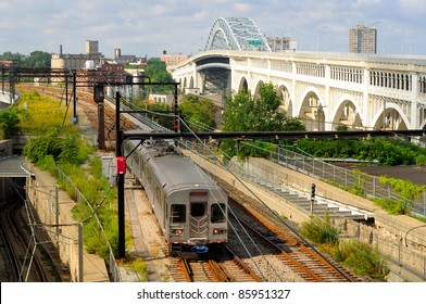 Rapid Transit Train In Cleveland Ohio With Detroit-Superior Bridge In Background
