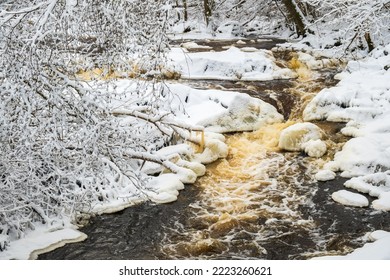 Rapid Water In A River With Ice And Snow