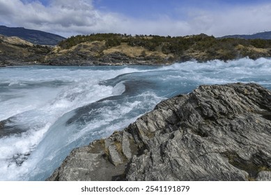 Rapids at the confluence of the turquoise Rio Baker and the glacier grey Rio Nef, between Puerto Guadal and Cochrane, Región de Aysén, Chile, South America - Powered by Shutterstock