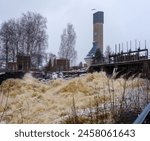 Jämsänkoski rapids and UPM paper mill in Jämsä, Finland in winter.
