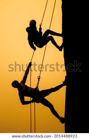 rappelling on the frog stone [[stock_photo]] © 