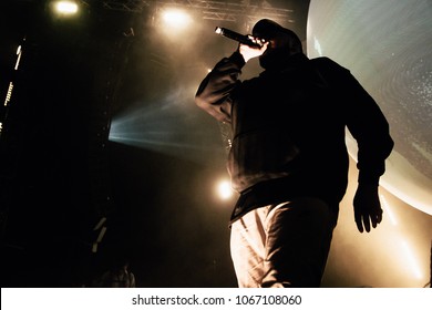 Rapper In Hoody With Microphone On The Stage. 