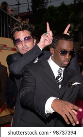 Rapper SEAN PUFFY COMBS Aka P. Diddy & Rock Star TOMMY LEE At The MTV Movie Awards In Los Angeles. 02JUN2001.